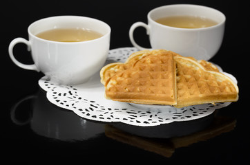 Tea and coffee with biscuits as the heart.