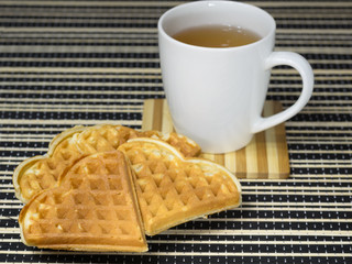 Tea and coffee with biscuits as the heart.