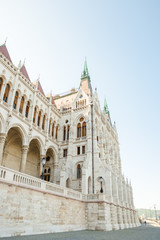 Building of Hungarian National Parliament viewed from the side of the Dunabe river in Budapest, Hungary