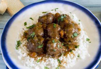 Meatballs with rice and vegetable and tomato sauce