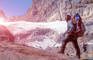 Portrait of Nepalese Mountain Guide staying on Glacier Sunny