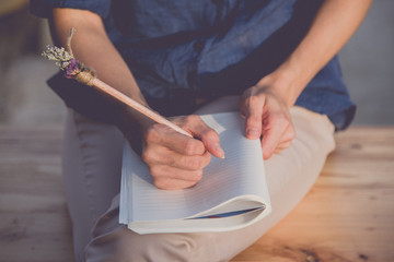 Close up of  people hand  writing on notebook