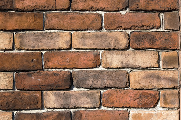 Brick wall with brown big bricks, texture or background