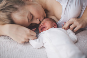 Fototapeta na wymiar Portrait of mother and her newborn baby.