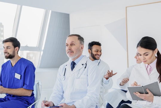 Joyful physicians are interested in new medicine notions