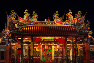 Decorated roof and second floor of traditional old chinese temple Seh Tek Tong Cheah Kongsi in Georgetown, Penang, Malaysia. UNESCO world heritage site. Night view.