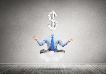 Headless meditating businessman