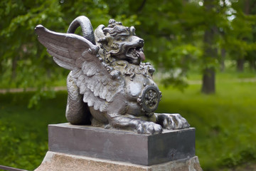 A metal figure of a winged dragon on the Dragon Bridge in the Alexander Park. Tsarskoye Selo, St. Petersburg, Russia.