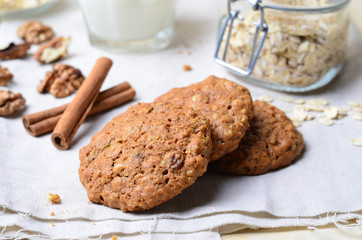 Homemade Oatmeal Cookies with Walnut and Cinnamon on bright background