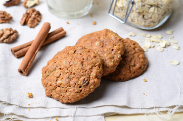 Homemade Oatmeal Cookies with Walnut and Cinnamon on bright background