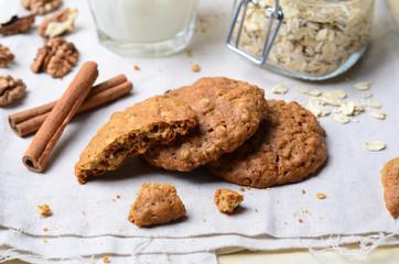 Homemade Oatmeal Cookies with Walnut and Cinnamon on bright background