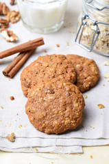 Homemade Oatmeal Cookies with Walnut and Cinnamon on bright background