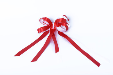 Red ribbon bow on white background