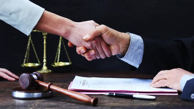 Handshake with justice gavel