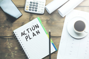 Action plan text written on notepad