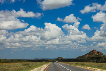 South African road through the savannas and deserts with marking