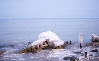 ice-covered rock on the beach