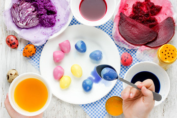 Dyeing Easter eggs with natural dye colors - obrazy, fototapety, plakaty
