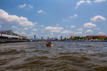 Naklejka premium Boats in Chao Phraya river in Bangkok, Thailand