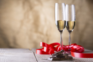 chocolate and two champagne glasses with red ribbon .valentines