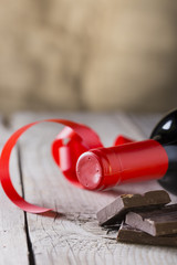 chocolate and bottle of red vine with red ribbon .valentines day