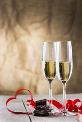 chocolate and two champagne glasses with red ribbon .valentines