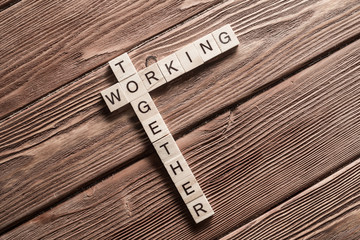 Conceptual business keywords on table with elements of game making crossword