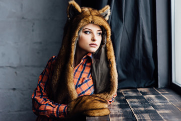 beautiful sexy girl wearing brown fur hat