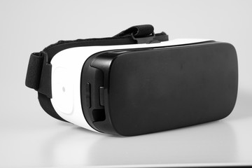 VR virtual reality glasses half turned isolated on white backgro