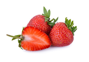 whole and half cut fresh strawberry on white background