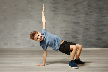 Cute funny boy in dance studio