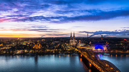 Fototapeta na wymiar Beautiful sunset above Cologne. Aerial view of the Cathedral - Dom and Hohenzollern bridge