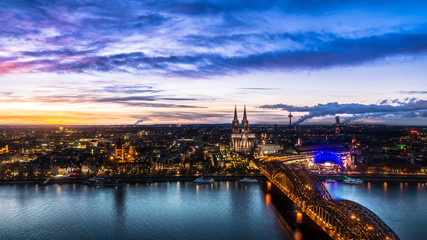 Obraz premium Beautiful sunset above Cologne. Aerial view of the Cathedral - Dom and Hohenzollern bridge