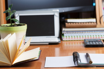 Office desk table with computer, supplies. Copy space for text