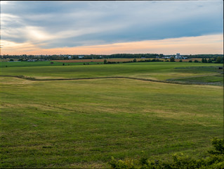 Fototapeta premium Sunset Over Rural Farm Land