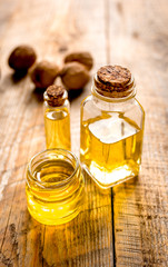 cosmetic and therapeutic walnut oil on wooden background