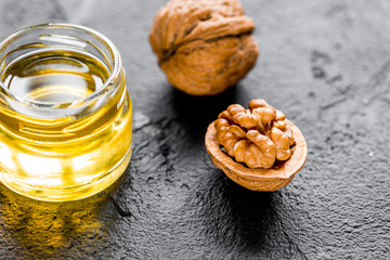 cosmetic and therapeutic walnut oil on dark background