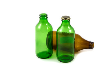 Variety of glass bottles isolated on white.