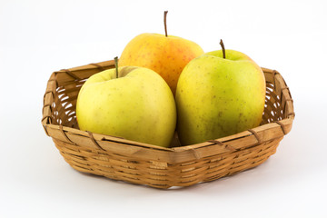 Fresh, Ripe apples in basket on white background.