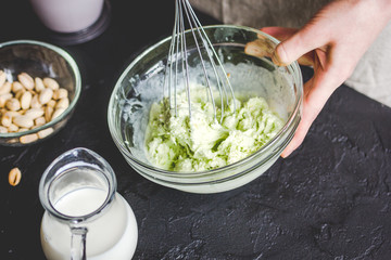 organic ice cream homemade process on dark background with hands