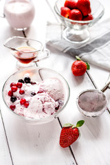organic homemade ice cream in glass bowl on wooden background