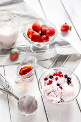 organic homemade ice cream in glass bowl on wooden background