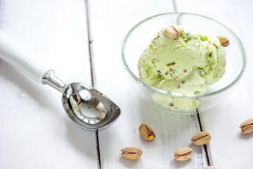 Fototapeta na wymiar organic homemade ice cream in glass bowl on wooden background