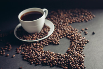 heart made of coffee beans and a cup with a drink