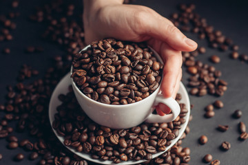 coffee beans in a white cup