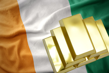 shining golden bullions on the cote divoire flag