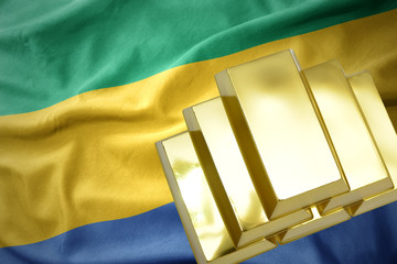 shining golden bullions on the gabon flag