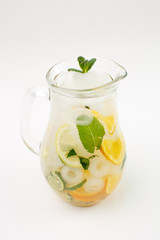 Beautiful fruit lemonade in a jar on a white background