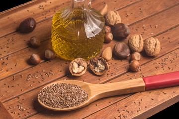 Fototapeta na wymiar Healthy Fat. Nuts, Olive oil and linseeds. Omega 3
