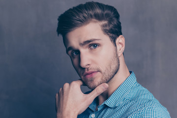 Portrait of handsome thoughtful man touching his chin